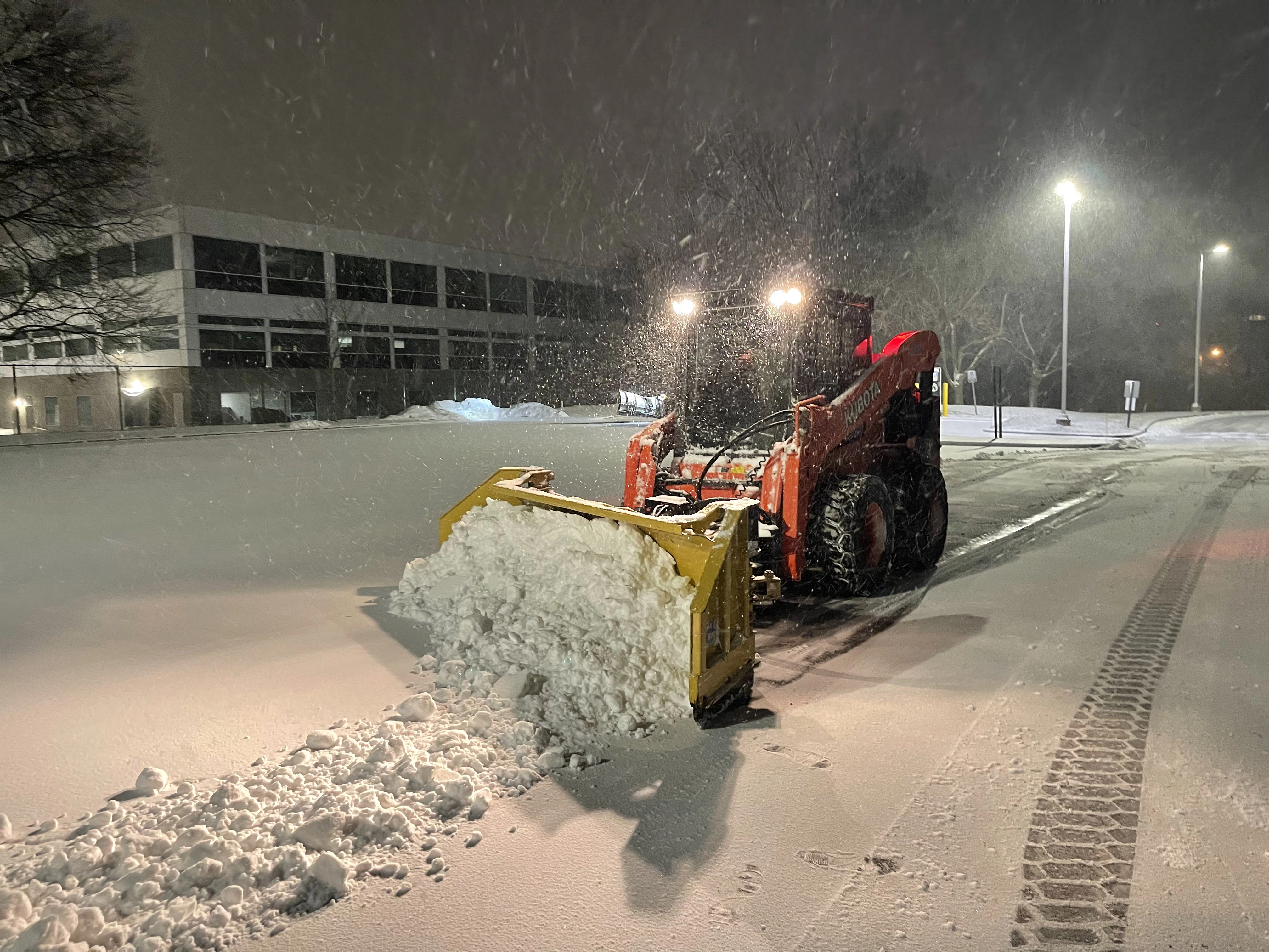 Snow plow truck clearing snow